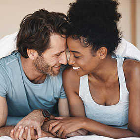 Man and woman smiling and holding hands after Alma Duo use